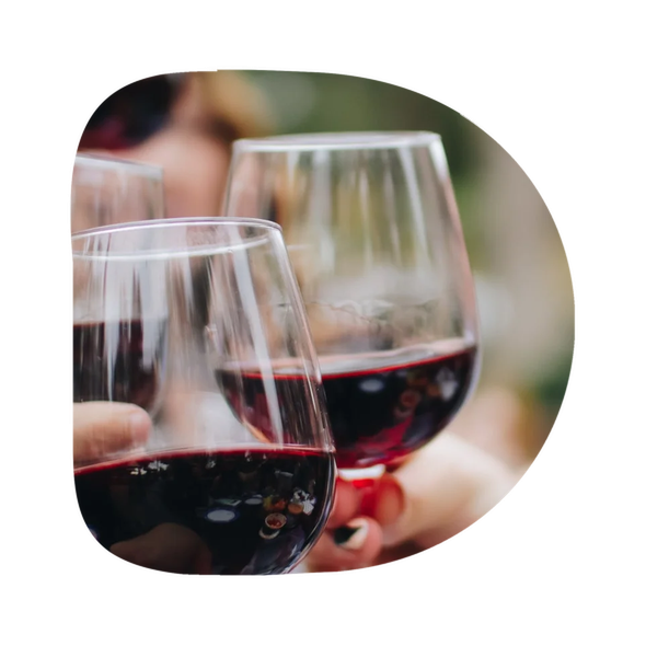 Wine glasses at an event, framed within a D